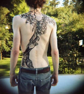 black ink abstract tattoo on back
