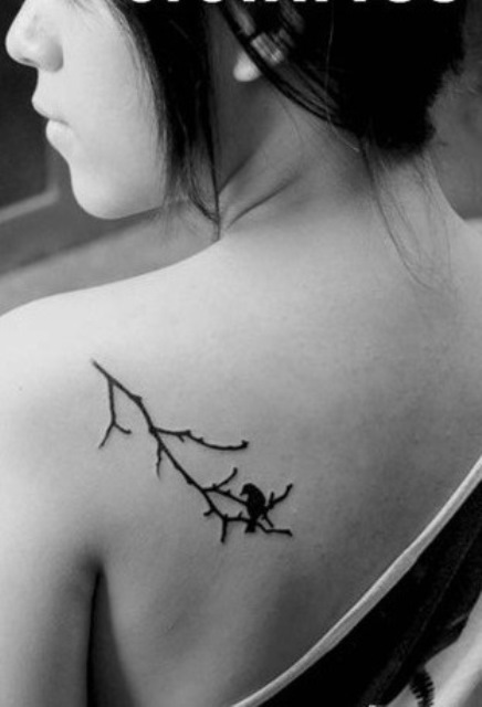 black ink little bird on branch tattoo