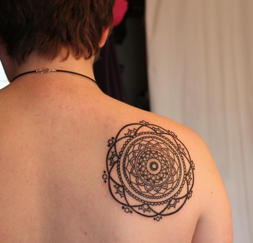 black ink mandala tattoo on back shoulder