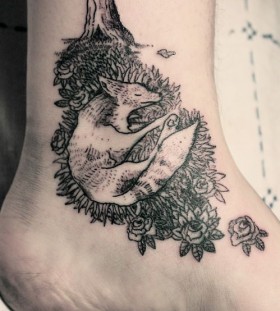 black ink sleeping fox tattoo