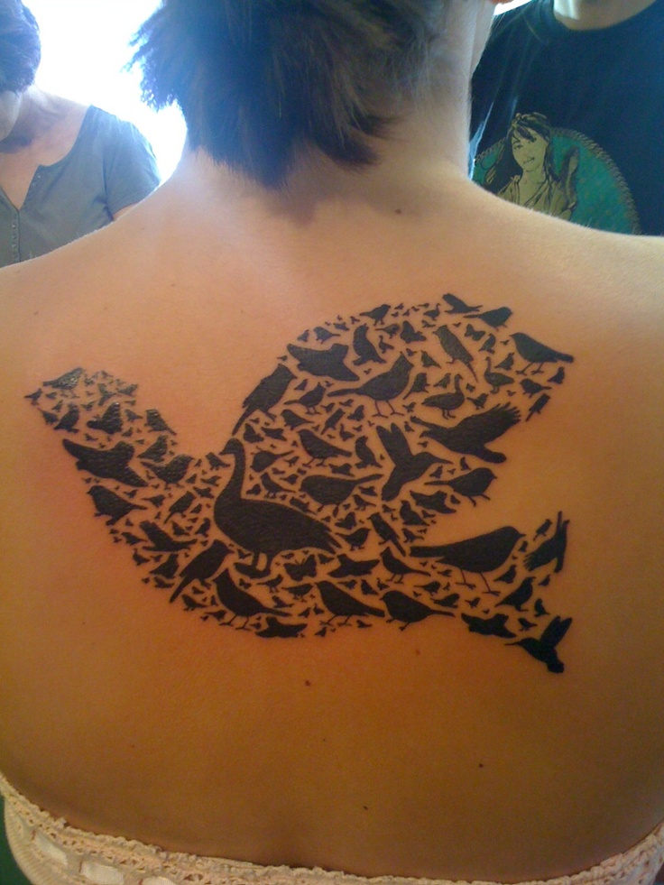black ink tattoo of birds on back