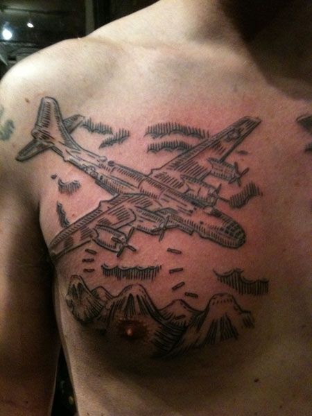 duke riley tattoo fighter plane dropping bombs