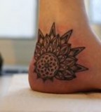 kenji alucky tattoo  flower on foot