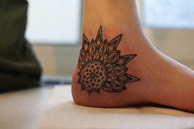 kenji alucky tattoo  flower on foot