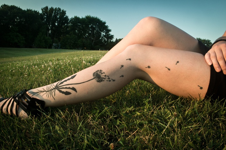 modern tattoo dandelion on leg