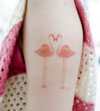 modern tattoo two pastel pink flamingos