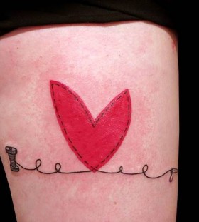 red heart and thread tattoo by matik