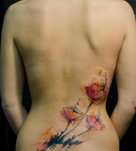 watercolor flowers tattoo on lower back by klaim