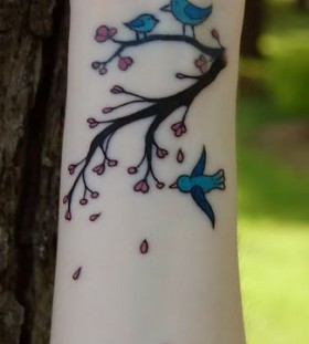 wrist tattoo bird on branch