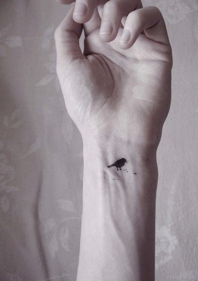 wrist tattoo tiny bird