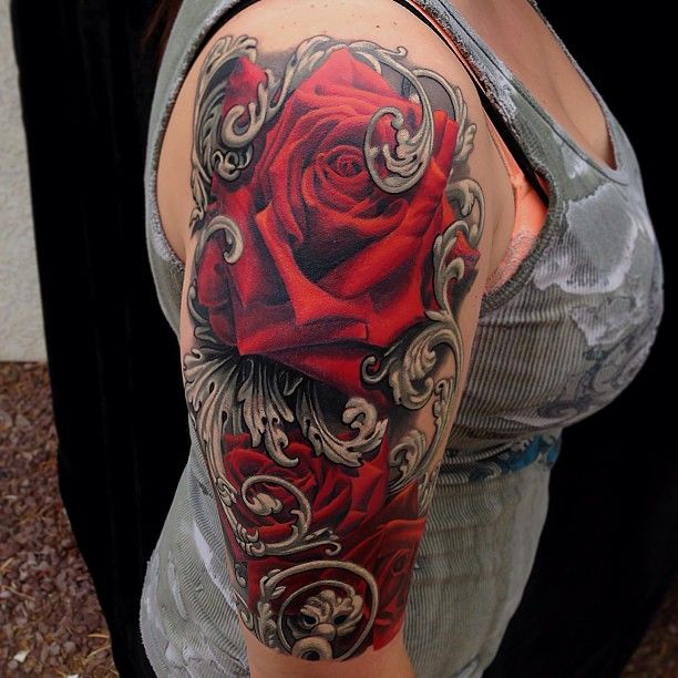 Arm red rose photorealistic tattoo