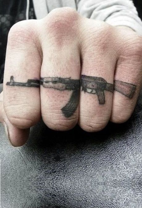 Awesome fingers guns tattoo