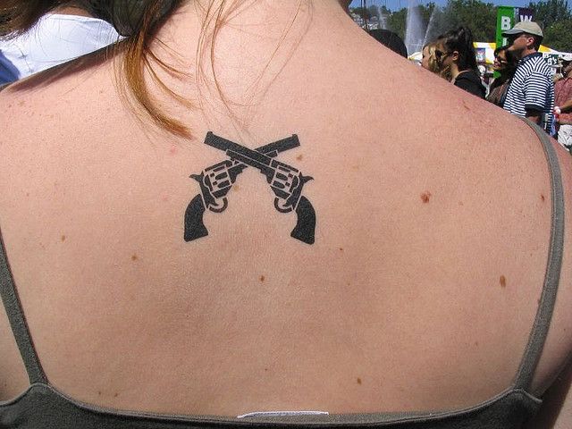 Back guns tattoo