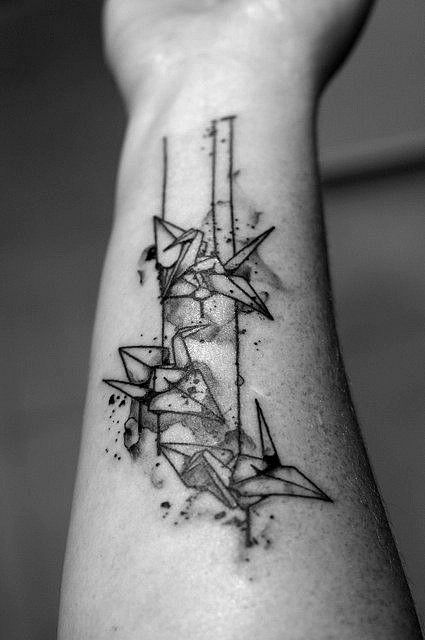 Black and white origami tattoo