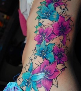 Blue and pink hip tattoo
