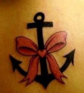 Bow and anchor tattoo
