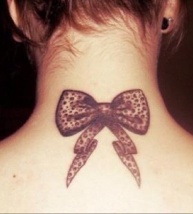 Bow leopard tattoo