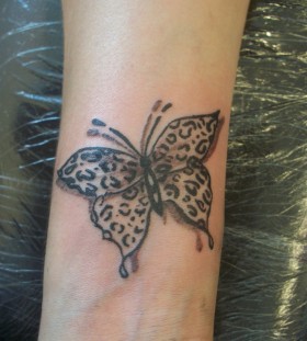 Butterfly leopard tattoo