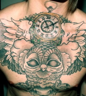 Chest clock tattoo