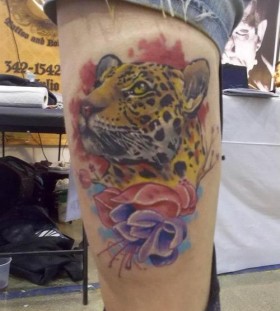 Colorful flowers and leopard tattoo