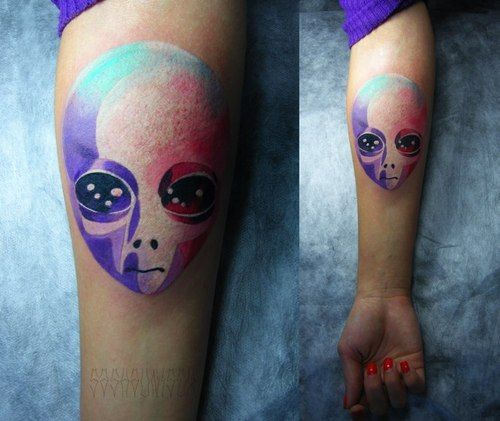 Colorful hand alien tattoo