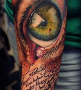 Deep green eye tattoo