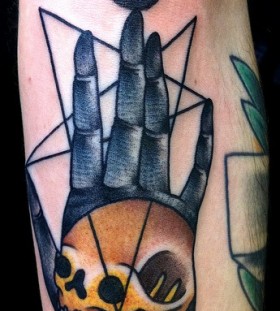 Fingers and skull symbols tattoo