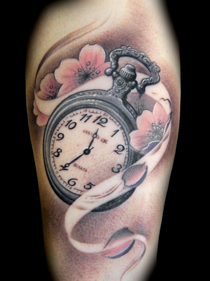 Flowers and clock tattoo