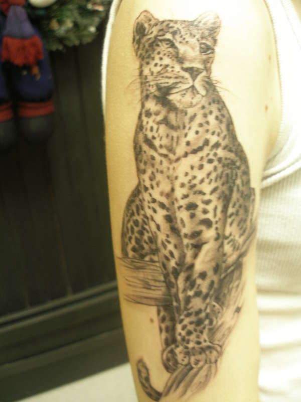 Full hand leopard tattoo