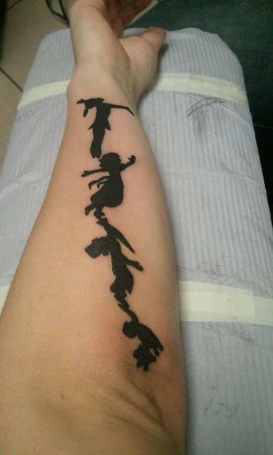 Hand Peter Pan tattoo