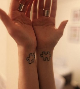 Hands puzzle tattoo