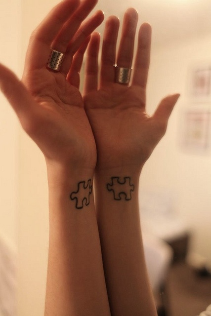 Hands puzzle tattoo