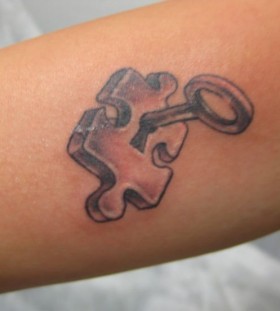 Key and puzzle tattoo