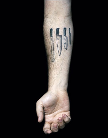 Knifes on hand tattoo
