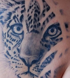 Leopard face tattoo