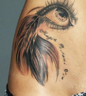 Lovely feather eye tattoo