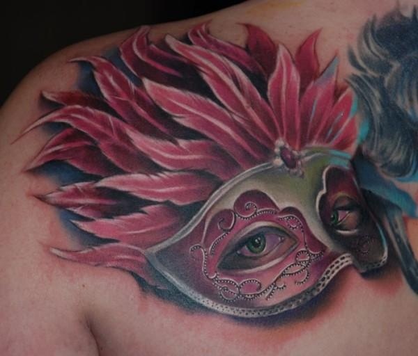Mask chest tattoo