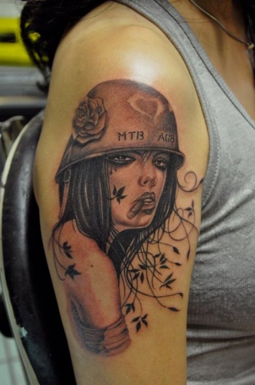 Military woman tattoo by Corey Miller