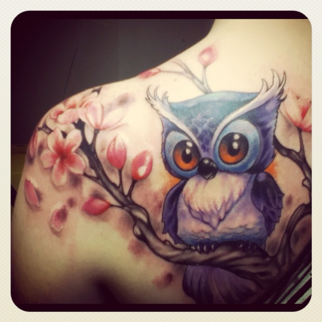 Owl orange eye tattoo