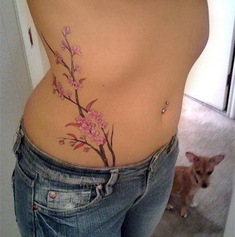 Pretty pink flowers hip tattoo