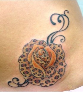 Rose and leopard tattoo