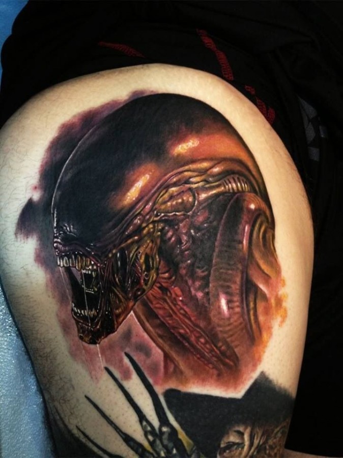 Scary man alien tattoo