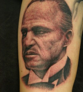 Serious man tattoo by Corey Miller