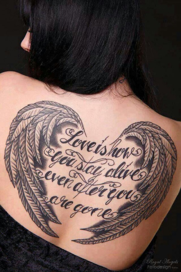 Woman back angel wings tattoo