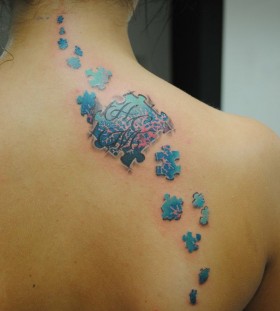 Woman back puzzle tattoo