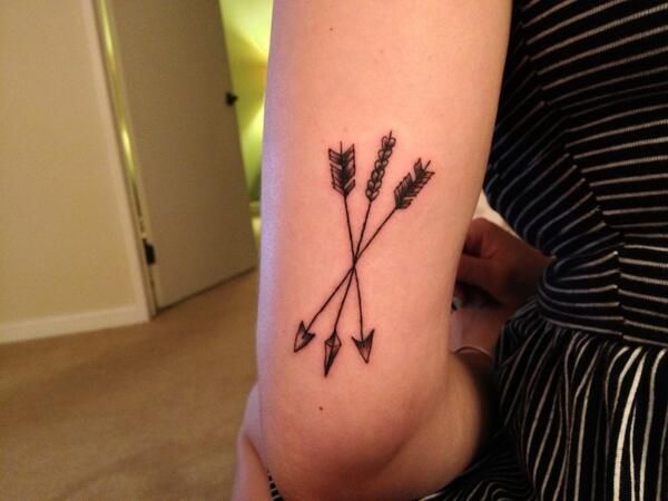 arrow tattoos crossed