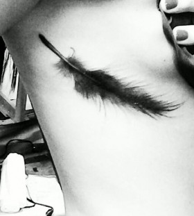 black feather tattoo faded