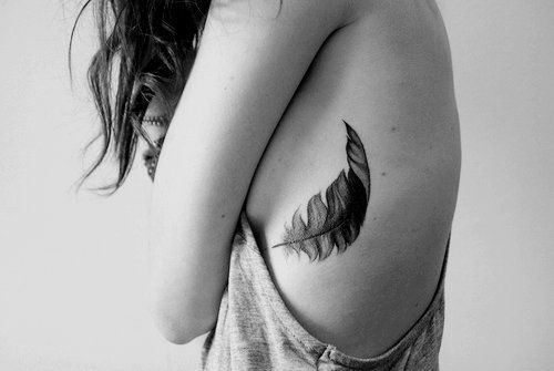 black feather tattoo for girls