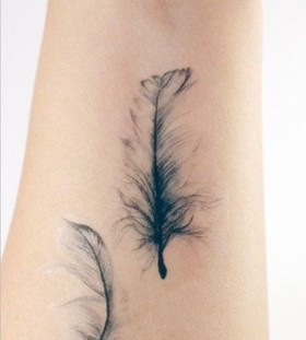 black feather tattoo looking so soft