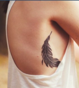 black feather tattoo upper body